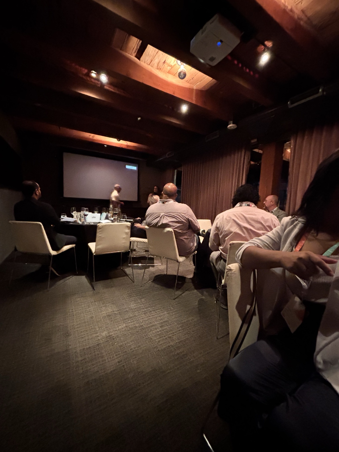 Guests continue their conversations in the private LTX dinner room after the presentation.