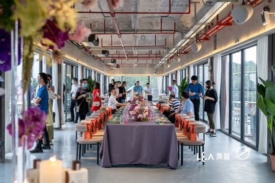 A long event table set inside the raw industrial venue