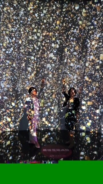 A live performance against a wall of golden particle light
